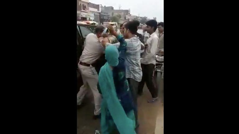 Viral video of Muslim man and woman beating police officer with slippers is from 2018