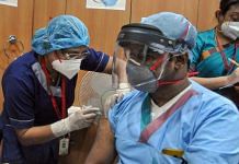 A medic administers the Covid-19 vaccine to a frontline worker, after the virtual launch of the vaccination drive by Prime Minister Narendra Modi, at AMRI-Dhakuria hospital, in Kolkata, Saturday, Jan. 16, 2021. | PTI