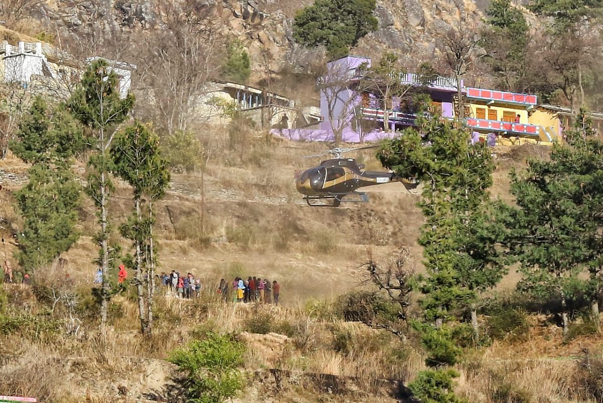 Rescue helicopters distributes food to people trapped in the mountains of Chamoli | Photo: Suraj Singh Bisht | ThePrint