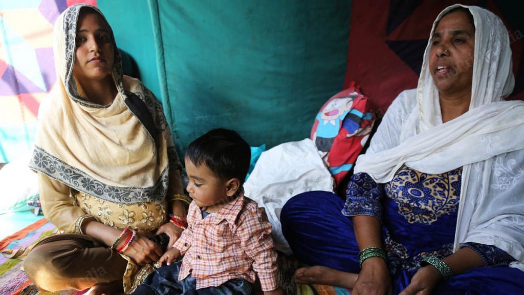 A pregnant Shabiha (left) pictured at a relief camp last year with her mother-in-law and older son | Photo: Manisha Mondal | ThePrint