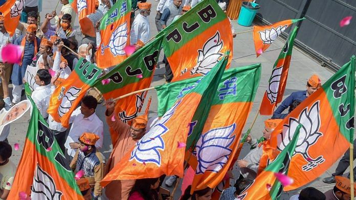 Representational image | BJP workers with party flags at a rally | Photo: PTI