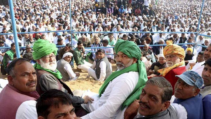Rakesh Tikait (centre, in green turban) with other leaders at a khap mahapanchayat in Haryana Sunday | Photo: PTI