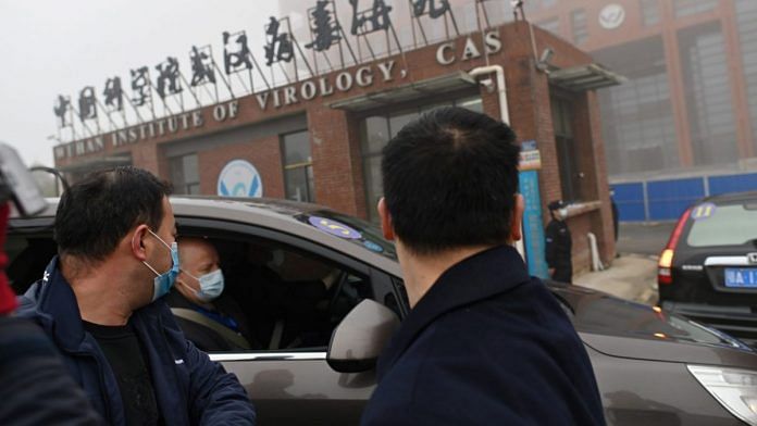 Members of the World Health Organization (WHO) team at the Wuhan Institute of Virology | Photographer: Hector Retamal/AFP/Getty Images via Bloomberg