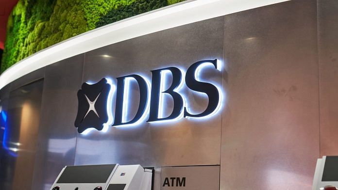 A DBS Group Holdings Ltd. logo atop an automated teller machine (ATM) at a bank branch in Singapore. | Photographer: Lauryn Ishak | Bloomberg