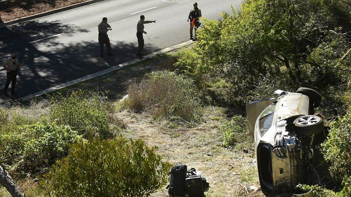 County Sheriff's officers investigate an accident involving famous golfer Tiger Woods along Hawthorne Blvd. in Ranch Paos Verdes, on 23 February 2021