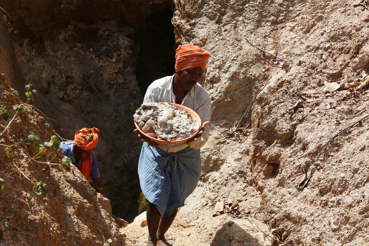 Sani Rai and Tulsi Rai remove scraps of mica from the cave they dug | Photo: Praveen Jain | ThePrint