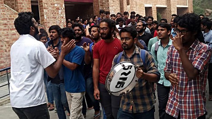Jawaharlal Nehru University (JNU) students shout slogans during a protest against the draft hostel manual | ANI