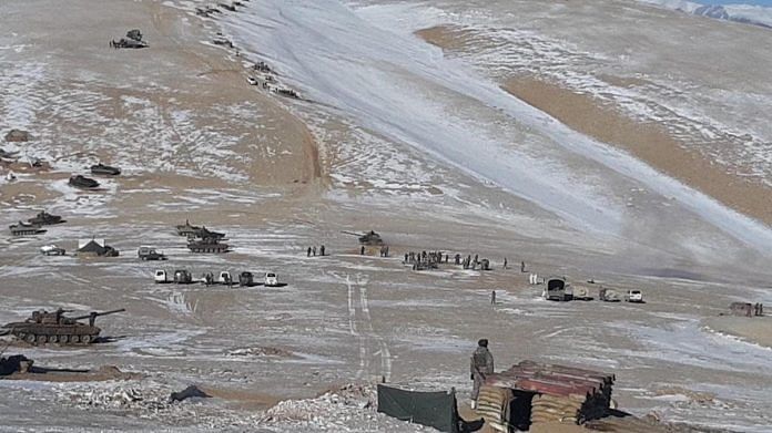Chinese PLA troops dismantling temporary structures erected near the Pangong Tso and marching back | Photo released by Indian Army