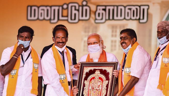 File photo | PM Modi being presented a memento by BJP leaders in Puducherry, 25 Feb 2021 | PTI