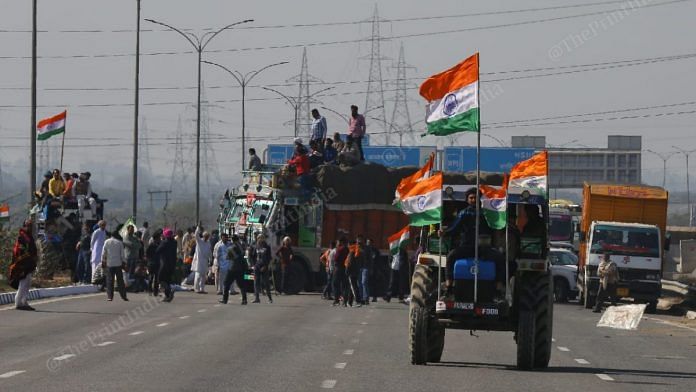 Farmers blocking the Kundli Manesar Palwal Expressway near the Singhu border as part of their countrywide chakka jam Saturday | Suraj Singh Bisht/ThePrint