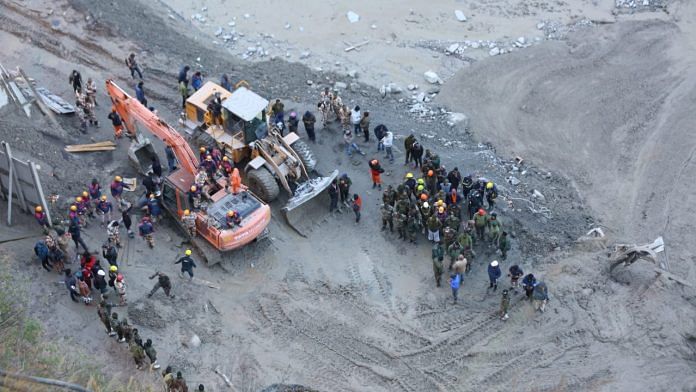 Workers line up for the next round of work in Uttarakhand on 8 February 2021 | Suraj Singh Bisht | ThePrint Workers line up for the next round of work in Uttarakhand on 8 February 2021 | Suraj Singh Bisht | ThePrint