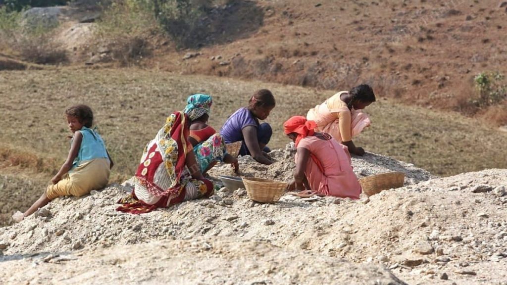 Women and children scavenge for mica near a mine in Devanjot village of Jharkhand's Giridih district | Photo: Praveen Jain/ThePrint