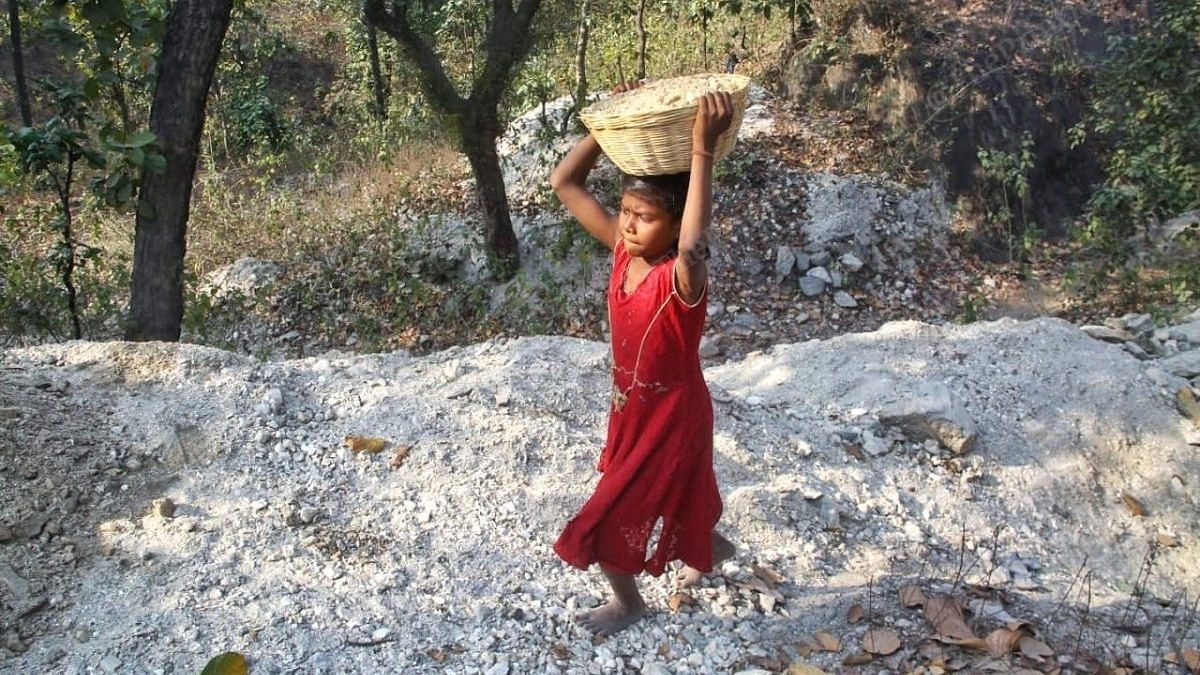 Chand Kumari, 9, carries pieces of mica on her head at the Nauma mines in Koderma | Photo: Pravin Jain/ThePrint