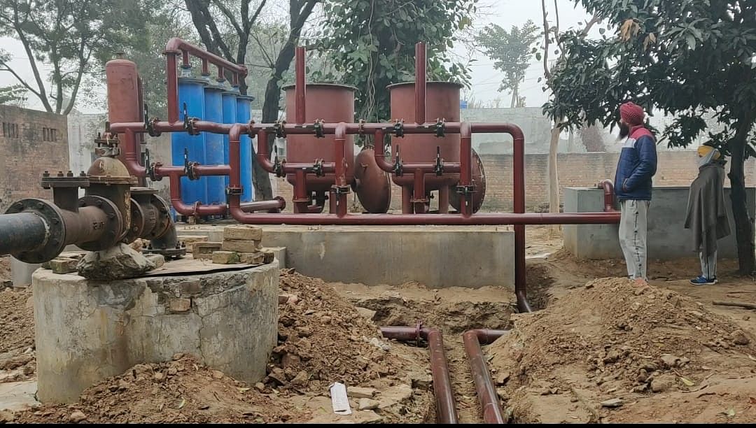 Swarn Singh, panchayat member in Dumna, near the water filtration plant set up in the village | Urjita Bhardwaj | ThePrint