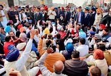 SAD President and former Punjab Deputy CM Sukhbir Singh Badal sits on a dharna along with Akali supporters after a clash, at the tehsil office in Jalalabad, on 2 February, 2021 | PTI