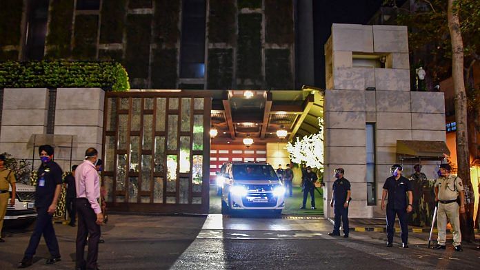 Police personnel guard Mukesh Ambani's residence, Antilia, after explosives were found in an abandoned car in its vicinity, in Mumbai, on 25 February 2021 | PTI Photo