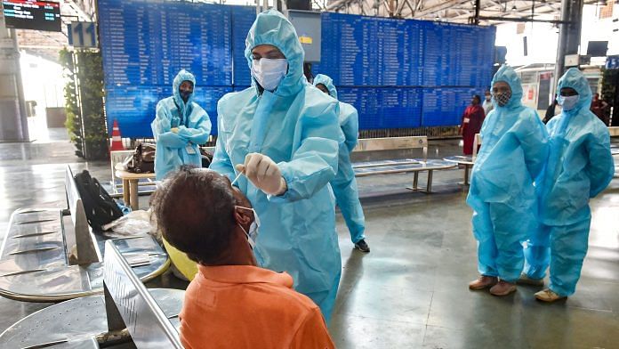 Health workers take samples from outstation passengers for Covid-19 tests, following a rise in cases, at Chhatrapati Shivaji Maharaj Terminus, in Mumbai, Wednesday, Feb. 17, 2021. | PTI