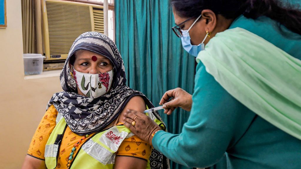 File photo | A medic administers the first dose of Covaxin to a frontline worker, in New Delhi | PTI