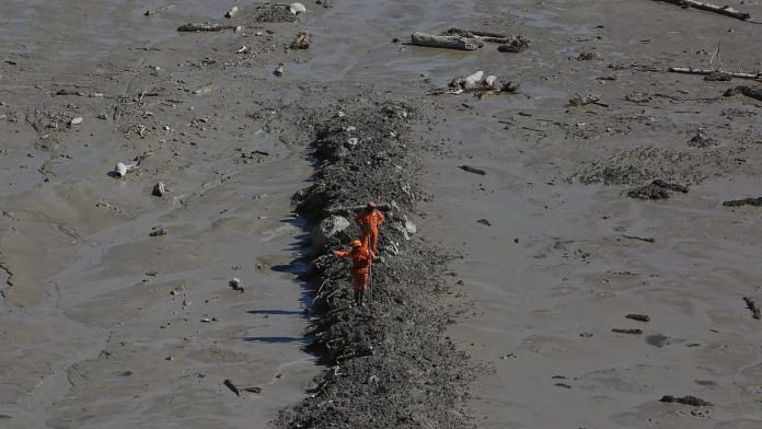 Chamoli flood NDRF personnel during a rescue operation near Tapovan hydro project tunnel, in Chamoli district of Uttarakhand