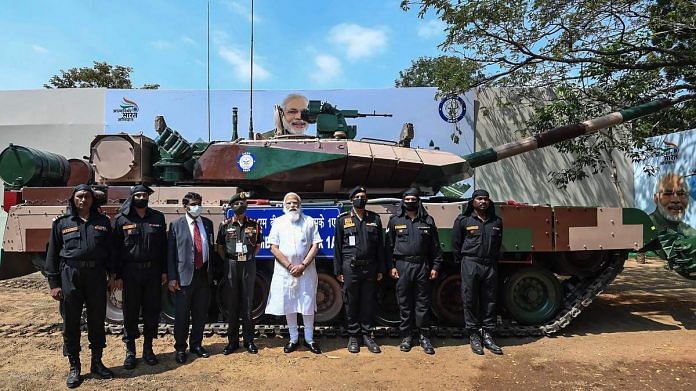 Prime Minister Narendra Modi and Army officials stand in front of a Arjun Mark 1-A tank | PTI