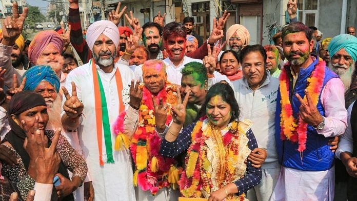 Punjab Finance Minister Manpreet Singh Badal (in white turban) with winning Congress candidates in Bathinda Wednesday | Photo: PTI
