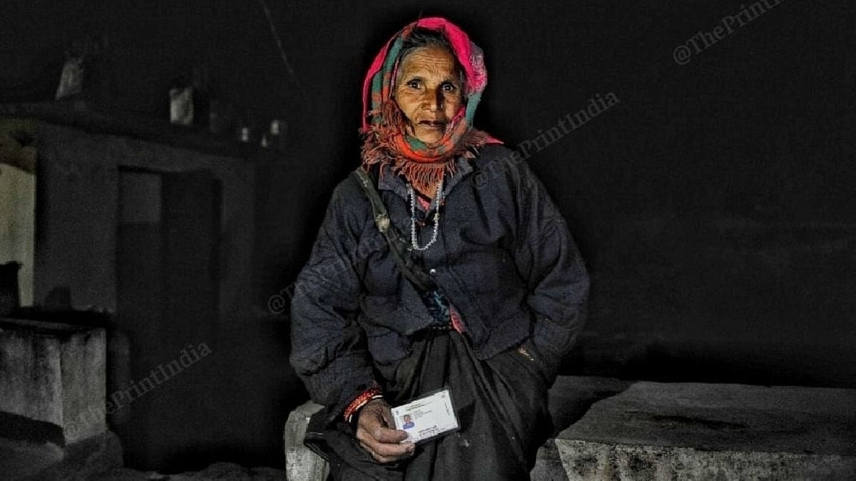 Rudrama Devi shows a photo of her son, who was working in the devastated NTPC power plant, in Raini. | Photo: Suraj Singh Bisht/ ThePrint