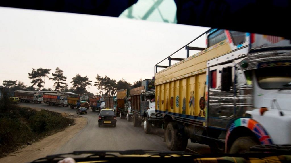 Trucks carrying coal sit in traffic on a highway in Jaintia Hills in Meghalaya, on 12 February, 2012 | Bloomberg