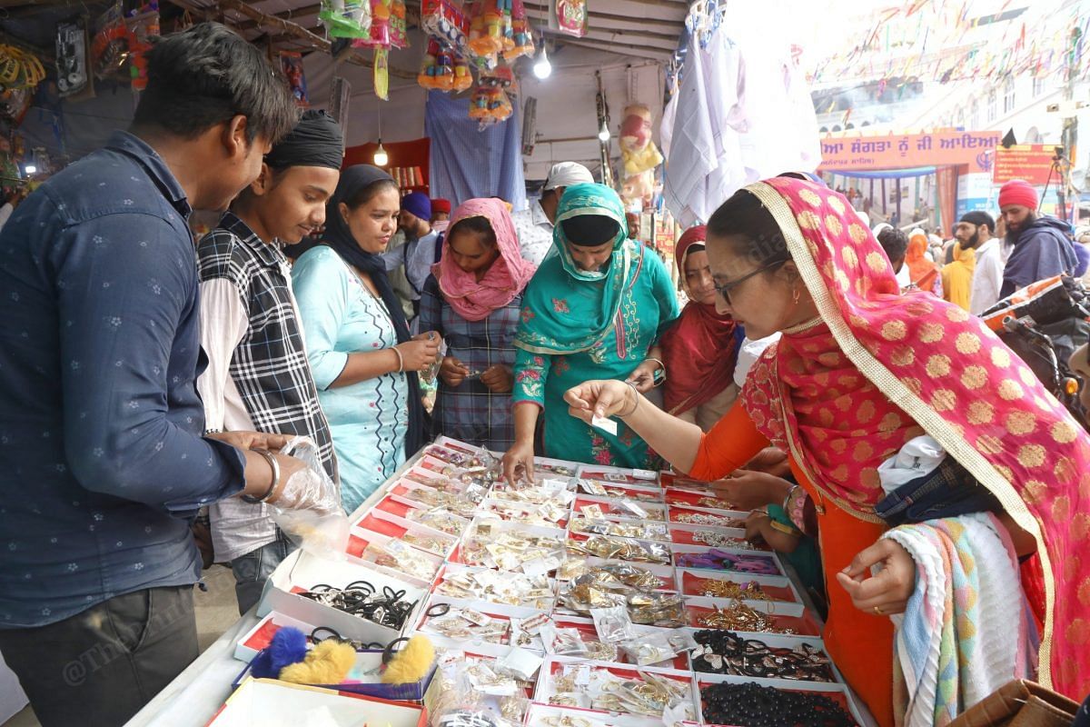  Several markets were also set up outside the gurdwara and revellers could be seen crowding around these stalls | Photo: Manisha Mondal | ThePrint