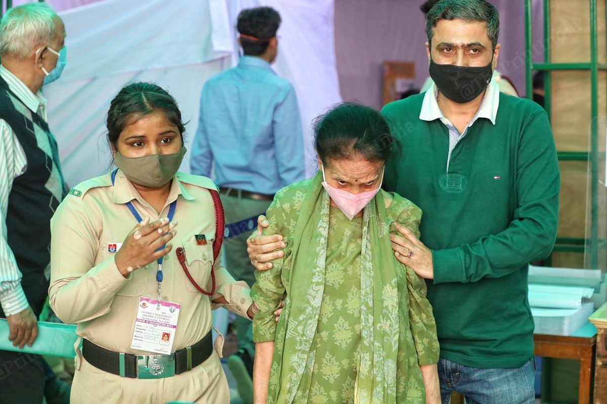 Sushil Khera in green kurta was the first one to be vaccinated | Photo; Manisha Mondal | ThePrint