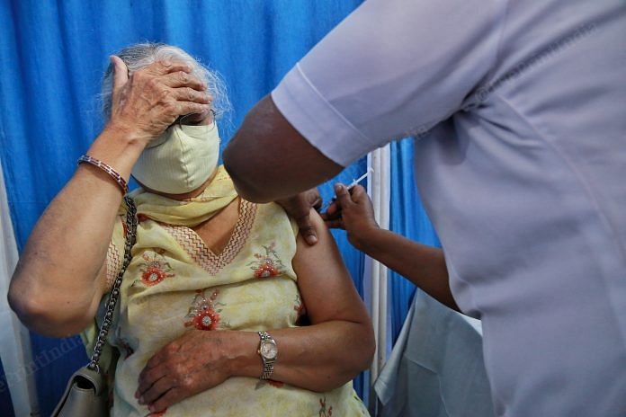 A woman gets vaccinated at Gangaram centre | Photo: Manisha Mondal | ThePrint
