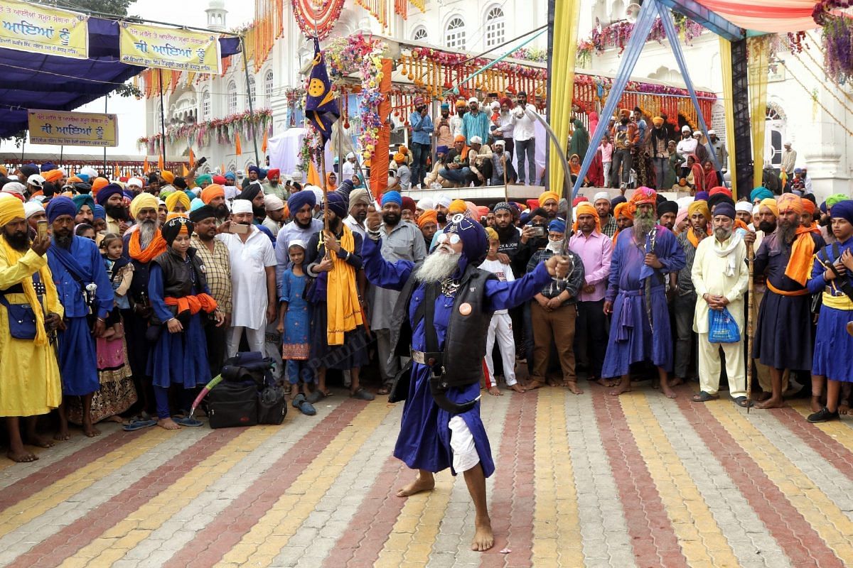  Nihangs, the armed sect of Sikihism, showcased tricks outside the Takhat Sri Kesgarh Sahab gurudwara | Photo: Manisha Mondal | ThePrint