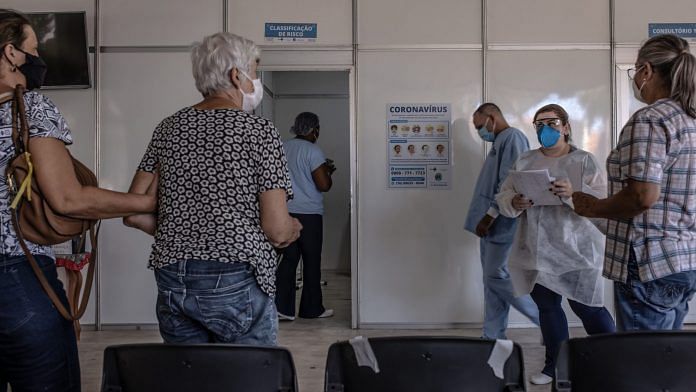 Healthcare workers speak with patients at an emergency care unit at a hospital in Araraquara, Brazil on 23 February, 2021 | Photographer: Jonne Roriz/Bloomberg