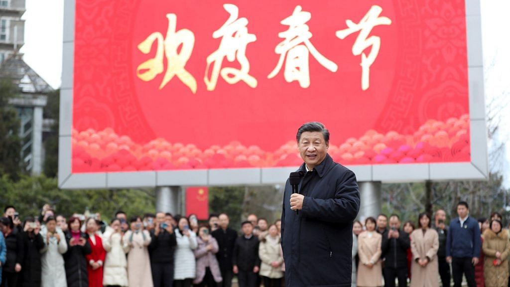 Chinese President Xi Jinping talks to local residents at Jinyuan community in Guanshanhu District of Guiyang, capital of southwest China's Guizhou Province, Feb. 4, 2021. | Photographer: Ding Haitao/Xinhua | Getty Images via Bloomberg