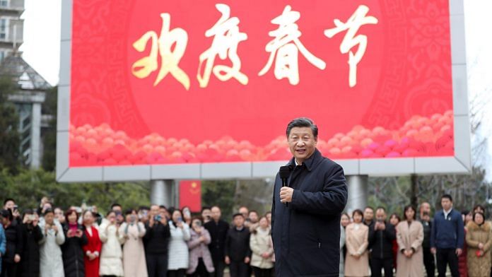 Chinese President Xi Jinping talks to local residents at Jinyuan community in Guanshanhu District of Guiyang, capital of southwest China's Guizhou Province, Feb. 4, 2021. | Photographer: Ding Haitao/Xinhua | Getty Images via Bloomberg