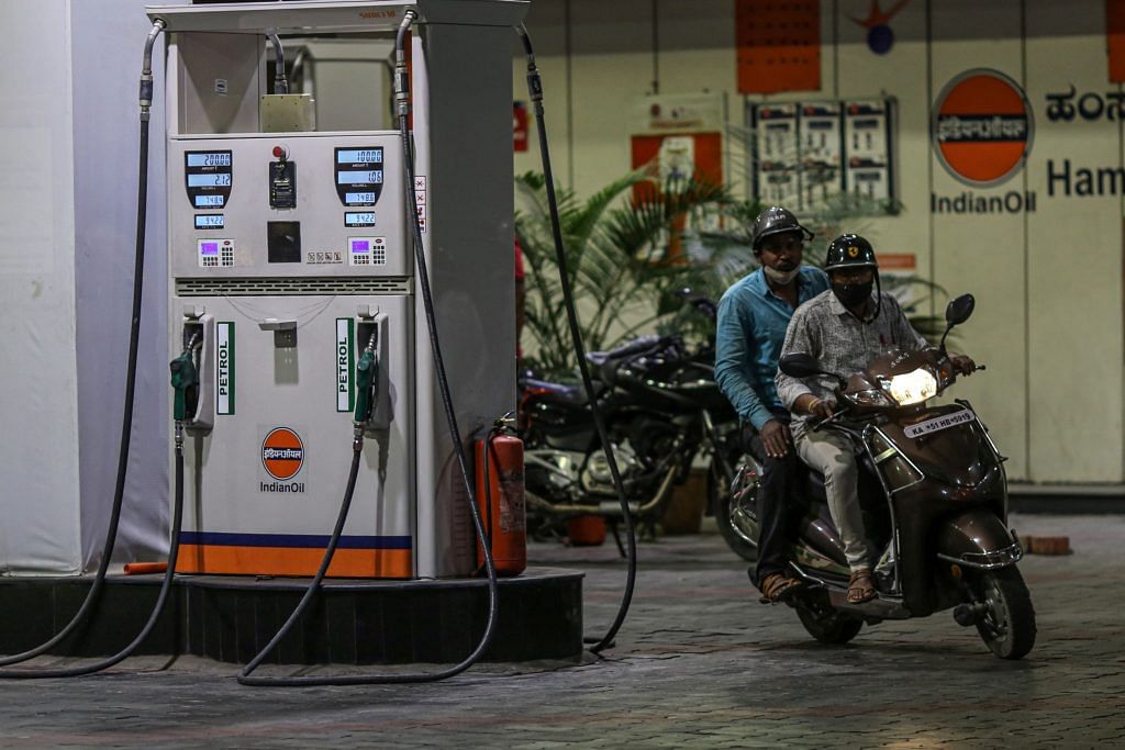 A motorcyclist exits an Indian Oil gas station in Bengaluru | Photo: Dhiraj Singh