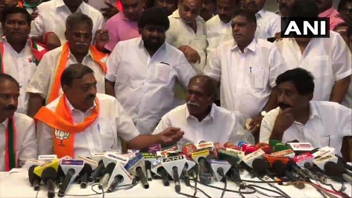 AINRC chief and former Puducherry chief minister N Rangasamy (middle) signing the seat-sharing agreement with the BJP at a press conference, on 9 March, 2021 | Twitter | @ANI