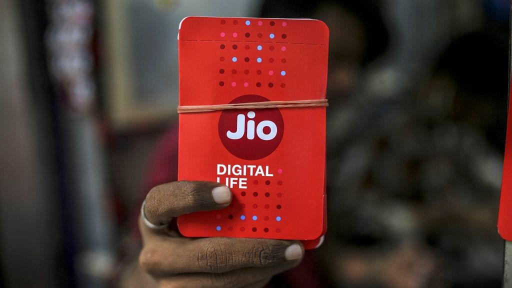 Reliance Jio sim card packets at a store in Mumbai | Image via Bloomberg