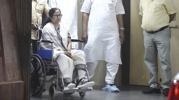West Bengal Chief Minister Mamata Banerjee leaves the hospital in a wheel-chair on 12 March 2021 | Swapan Mahapatra | PTI