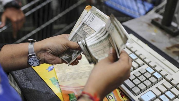 Representative image | An employee counts rupee notes | Dhiraj Singh | Bloomberg