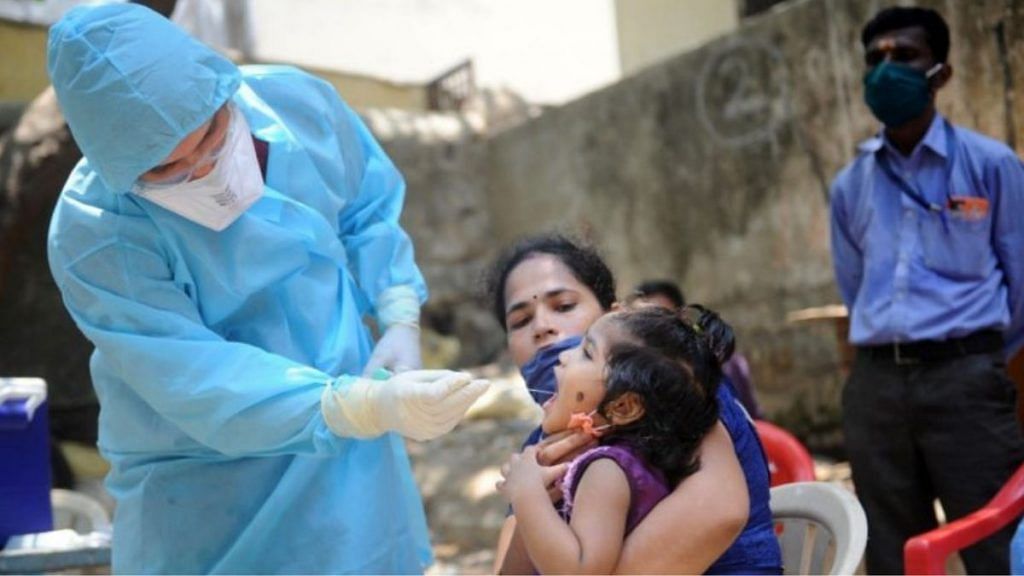 A medic takes a child's swab to test for Covid-19 | Representational image | PTI