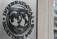 Signage displayed outside the IMF | Alex Wroblewski | Bloomberg