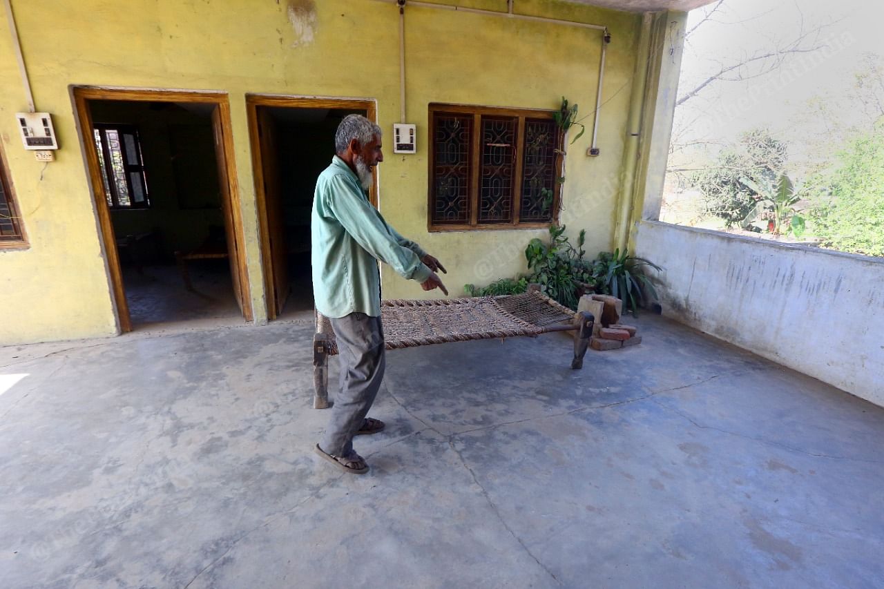 Sattar Ali walks through the verandah on the first floor, one of the places where members of the Ali family were killed in April 2008 | Praveen Jain | ThePrint