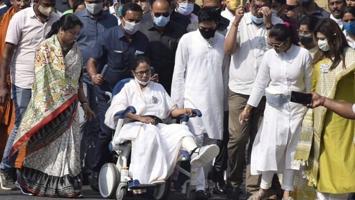 West Bengal CM Mamata Banerjee (in wheelchair) and her Trinamool Congress colleagues at a rally in south Kolkata Sunday | Photo: Ashok Nath Dey | ThePrint