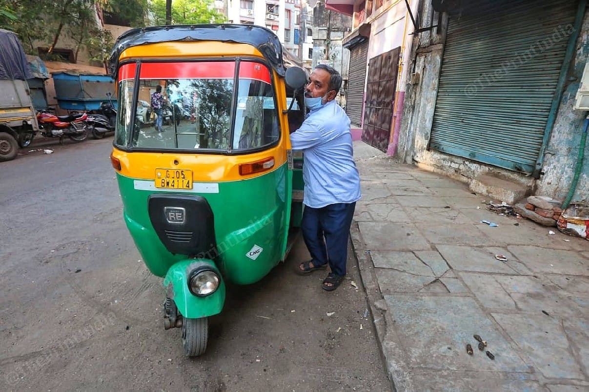 Asif Shaikh Sharbati, who worked with the Surat health department, now drives an auto rickshaw for a living | Photo: Praveen Jain/ThePrint
