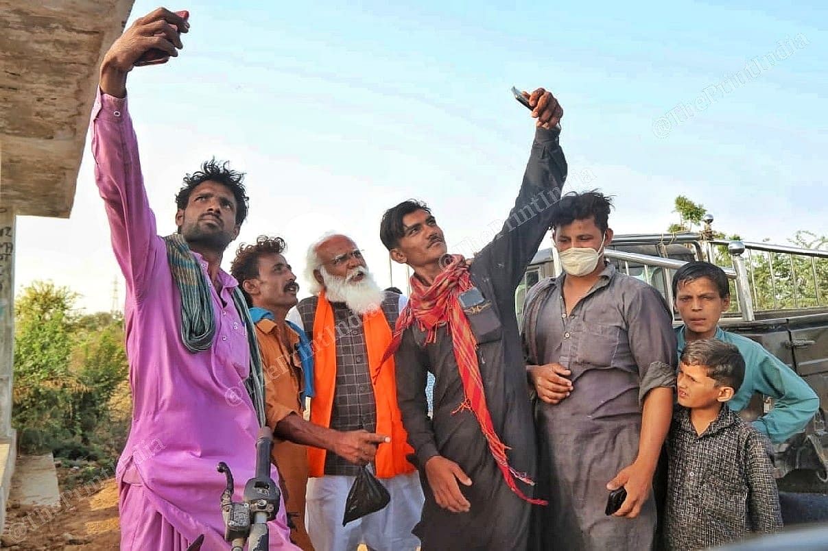 Residents of Bhuj taking selfie with Lalji Devaria | Photo: Praveen Jain | ThePrint 