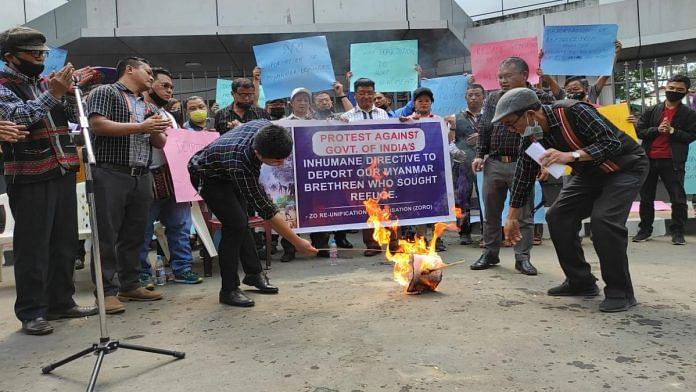 Copies of the 10 March Home Ministry order, calling for the influx of refugees from Myanmar to be checked, are burnt in Aizawl Tuesday during a demonstration organised by the NGO Zo Reunification Organisation | Adam Saprinsanga | ThePrint