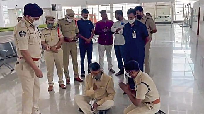 Leader of Opposition in Andhra Pradesh Assembly N Chandrababu Naidu stages a sit-in protest inside the arrival lounge of the Tirupati airport as police sought to detain him and prevent his entry into the temple town, at Renigunta near Tirupati, in Chittoor district, Monday, March 1, 2021. | PTI