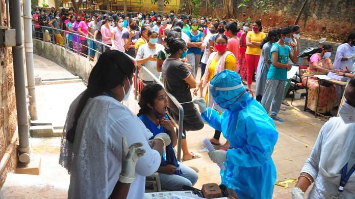 Medics collect samples from students for Covid-19 test at Andhra University Engineering College in Visakhapatnam, Saturday, 27 March, 2021. | PTI