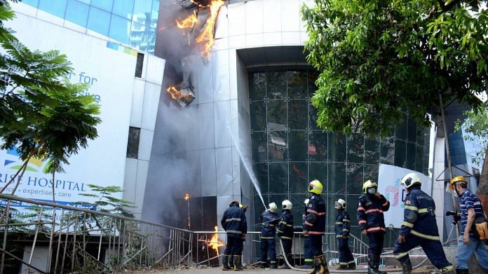 Firefighters attempt to douse a blaze at Dreams Mall, affecting patients admitted in the nearby Covid-19 dedicated Sunrise Hospital in Mumbai, on 26 March 2021 | PTI