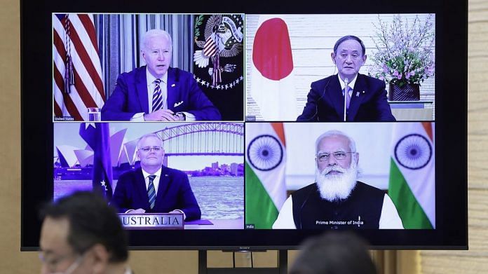 Joe Biden (top left), Yoshihide Sug (top right), Scott Morrison (bottom left), and Narendra Modi, during the virtual Quadrilateral Security Dialogue (Quad) meeting, on 12 March 2021 | Bloomberg